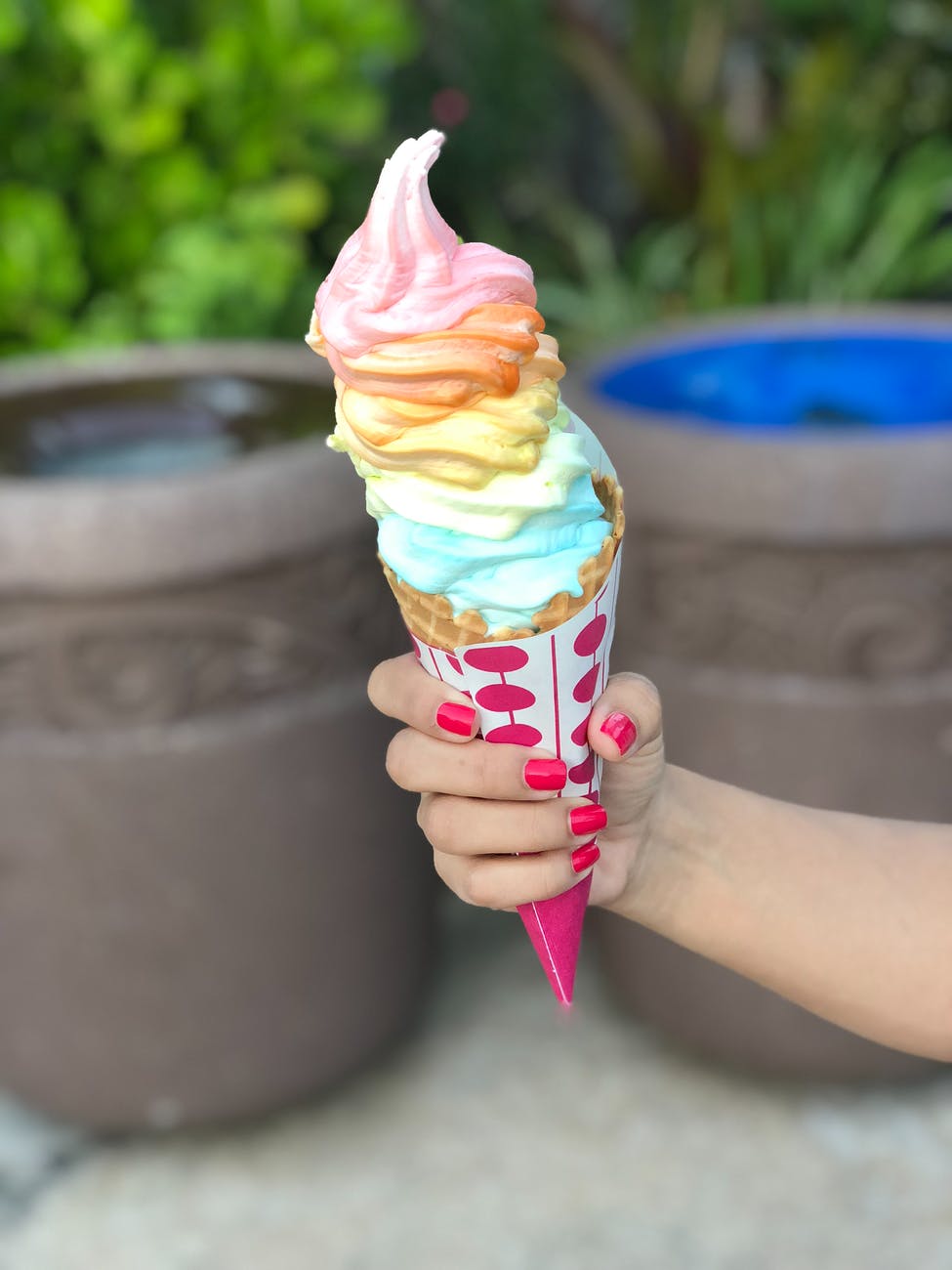 selective focus photography of person holding ice cream